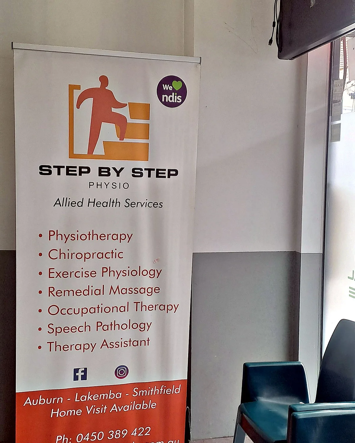 Step By Step Physio banner in the waiting area at our Lakemba clinic